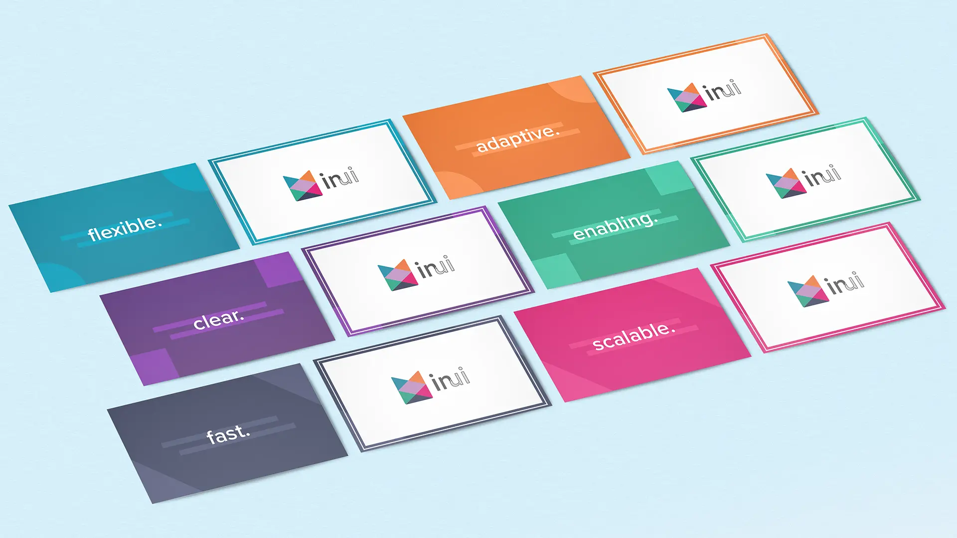 A number of business cards displaying the In Ui branded logo alongside call to action words.